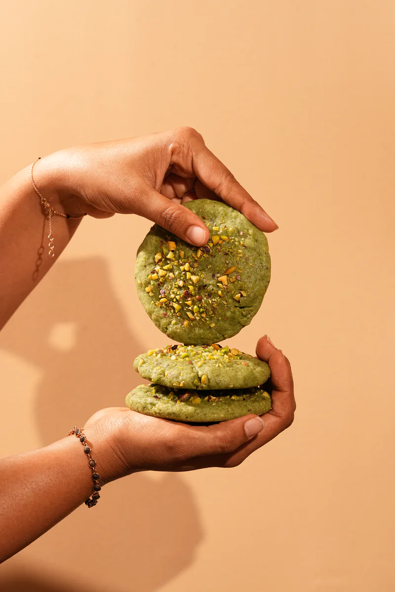 Pistachio cookies held in hand