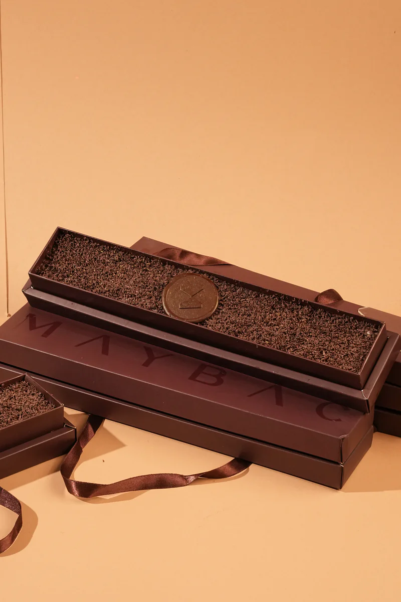 An open Maybac chocolate box