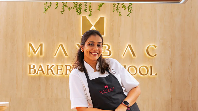 Rutu in a Maybac Bakery & School apron